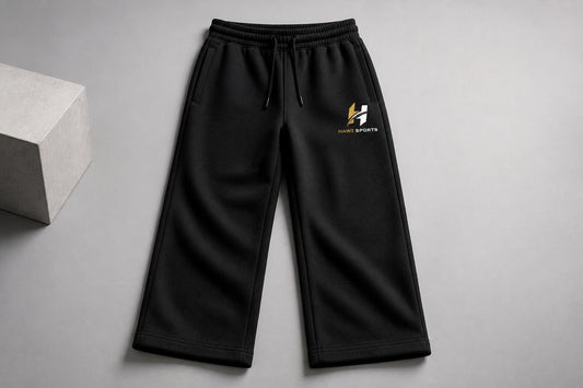 Black wide-leg sweatpants with Hawi Sports logo and drawstring waist