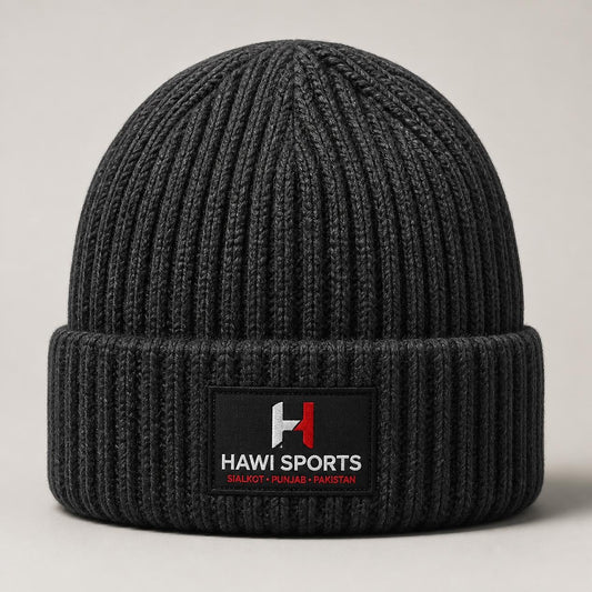 Dark ribbed knitted beanie with folded cuff and Hawi Sports logo patch