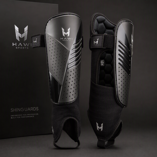Black Hawi Sports football shinguards with protective shells, straps and padded sleeves